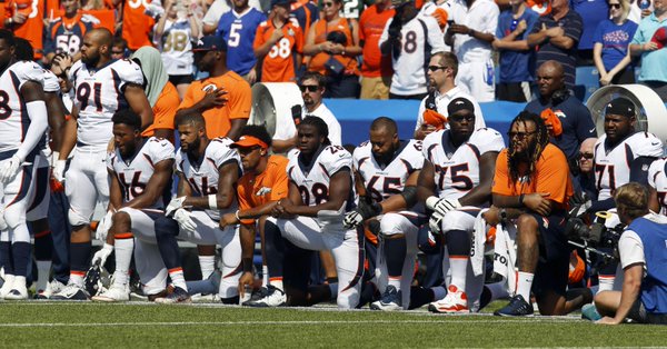 Photo published for In protests, NFL comes together for one of its most powerful days